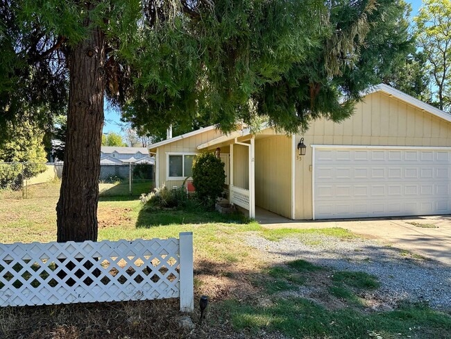 Building Photo - Charming Redding Home with Fireplace & Vau...