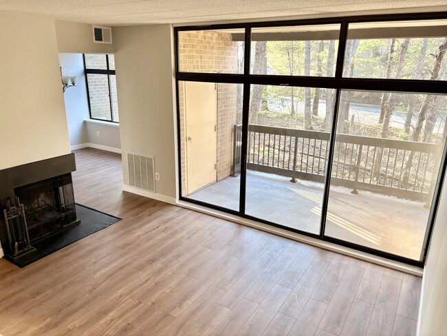 Living and balcony - 11557 Rolling Green Ct Apartments