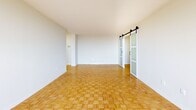 This 840 square foot apartment in Toronto offers a blend of comfort and modern design. The space is efficiently laid out with two bedrooms, including a primary bedroom of 190 square feet, and one bathroom. The living areas are characterized by beautiful parquet flooring, which adds warmth and elegance to the space.

Large windows are a prominent feature, allowing ample natural light to flood the rooms and providing scenic city views. The modern kitchen is equipped with white cabinetry, ample counter space, and essential appliances, including a stove and range hood. The bathroom features a clean, contemporary design with a bathtub and shower combination.

The apartment includes a balcony, offering an outdoor extension to the living space. The interior is painted in neutral tones, creating a bright and airy atmosphere throughout. Sliding glass doors in the living area lead to the balcony, enhancing the connection between indoor and outdoor spaces.

The layout includes a hallway and closet space, ensuring practical storage solutions. The overall design of the apartment emphasizes openness and functionality, making efficient use of the 840 square feet. Located at 2085-2101 Islington Ave in Toronto, this single-floor apartment combines urban living with comfortable, well-designed interiors.