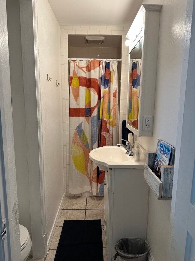 bathroom w/ shower, sink, toilet - 305 S Elm St