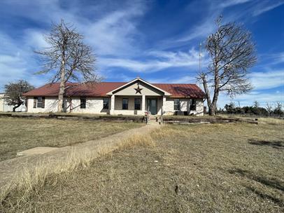 Building Photo - "Charming 3-Bed Oasis on US Highway 87: Sp...