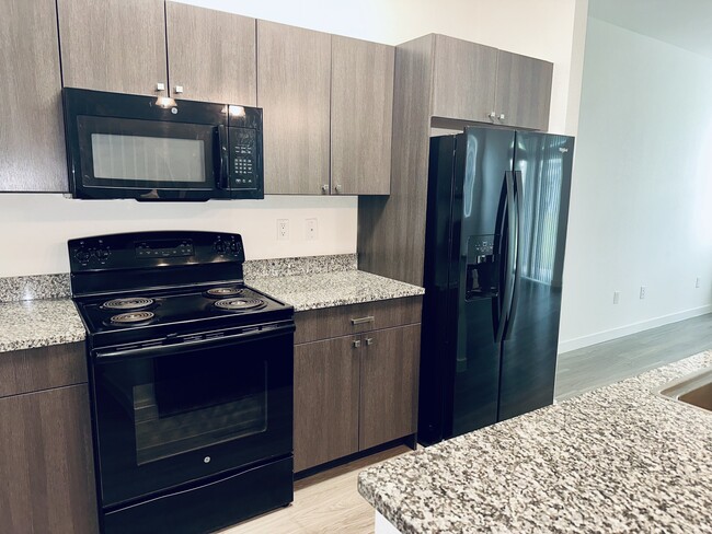 Kitchen New-style Refrigerator - Torino Lakes Townhomes