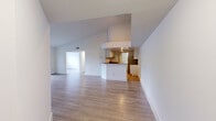 Located at 10645 Hammocks Blvd in Miami, FL, this well-appointed three-bedroom, one-bathroom residence offers a thoughtfully designed single-floor layout with a generous overall footprint. Light wood-style flooring runs throughout, creating a cohesive and clean aesthetic across all rooms.

The open-concept living area is bright and airy, featuring vaulted ceiling lines that lend a sense of height and volume. It flows seamlessly into the kitchen, which is equipped with white cabinetry, granite countertops, a subway tile backsplash, a stainless steel sink, and a peninsula that defines the space without sacrificing openness.

The spacious primary bedroom offers ample room for furnishings and includes dedicated closet space. Two additional bedrooms provide versatility for various living arrangements, with one room featuring a window that brings in natural light and outdoor views. Two closets serve the unit, including a walk-in style closet with wire shelving for organized storage.

The bathroom is clean and functional, featuring a tiled walk-in shower, a granite-topped vanity with an undermount sink, and a large mirror. A dedicated laundry room houses full-size washer and dryer units alongside the water heater and HVAC system. The unit also includes a balcony, adding a welcome outdoor extension to the living space.
