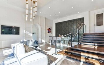 Indoor Lounge Area with Upholstered Sofas and Raised Bar Seating Section - The Lights at Northwinds