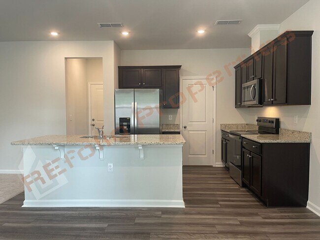 Building Photo - BRAND NEW Beautiful Townhouse Backed to Wo...