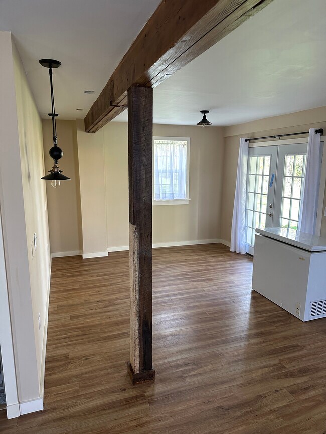 Bed wall and doors to rear gravel patio. Drop lights are spaced for a king bed/80" sofa. - 1779 State Route 96