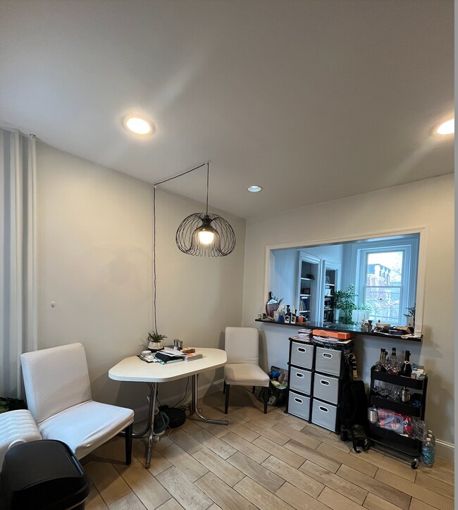 Kitchen with breakfast bar facing living room - 3702 Spring Garden St