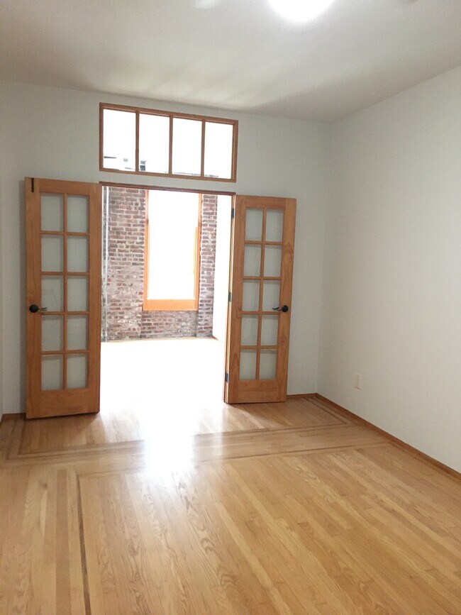 View of 2 rooms: living/office, bedroom. - 1876 DeKalb Ave