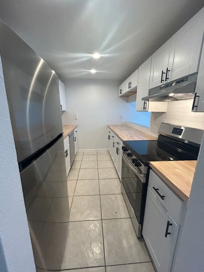 Building Photo - Welcome Home Savings! — Get 50% off your f...