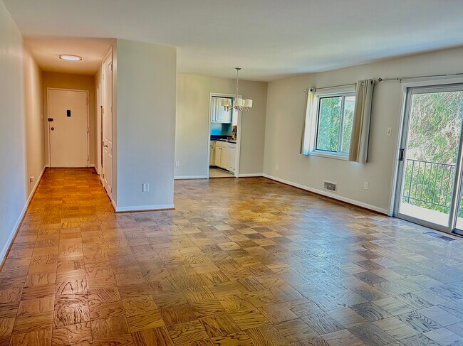 Sun-filled living room & dining room with balcony, entryway and kitchen - 10618 Montrose Ave