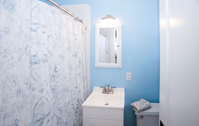 Bathroom with new vanity, sink, mirror and light. Newly painted Grey - not shown in image - 181 Mills St