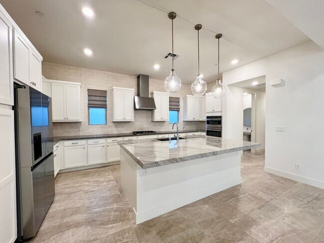 Building Photo - HIGHLY UPGRADED TOWNHOME IN TRILOGY SUMMER...