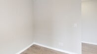 Located at 1020 Paisley Rd in Guelph, Ontario, this well-appointed 2-bedroom, 2-bathroom unit offers a thoughtfully designed single-floor layout with generous living space. The open-concept kitchen is outfitted with white shaker cabinetry, dark countertops, stainless steel appliances including a refrigerator, electric range, dishwasher, and microwave, and is finished with light tile flooring. A breakfast bar with pendant lighting connects the kitchen seamlessly to the dining area and living space, which features light hardwood-style flooring and bright windows that bring in natural light. Both bedrooms are comfortably sized, with the primary bedroom offering a mirrored sliding-door closet. The second bedroom is equally bright and well-proportioned. The two bathrooms are clean and functional — one features a walk-in shower with a built-in grab bar, and the other includes a full soaker tub-shower combo. A dedicated laundry room houses a full-size washer and dryer. A dedicated closet provides additional storage. The unit also includes a private balcony. Neutral tones and consistent finishes throughout create a cohesive and modern ambiance suitable for a variety of lifestyles.