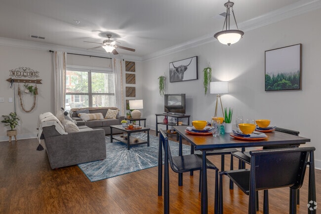 4BR, 4.5BA - 2,333SF - Living Room/Dining Room - The Retreat at Gainesville