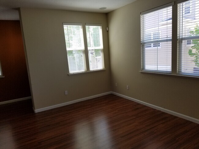 A different angle of the main living area. - 2878 Hilltop Mall Road Townhome