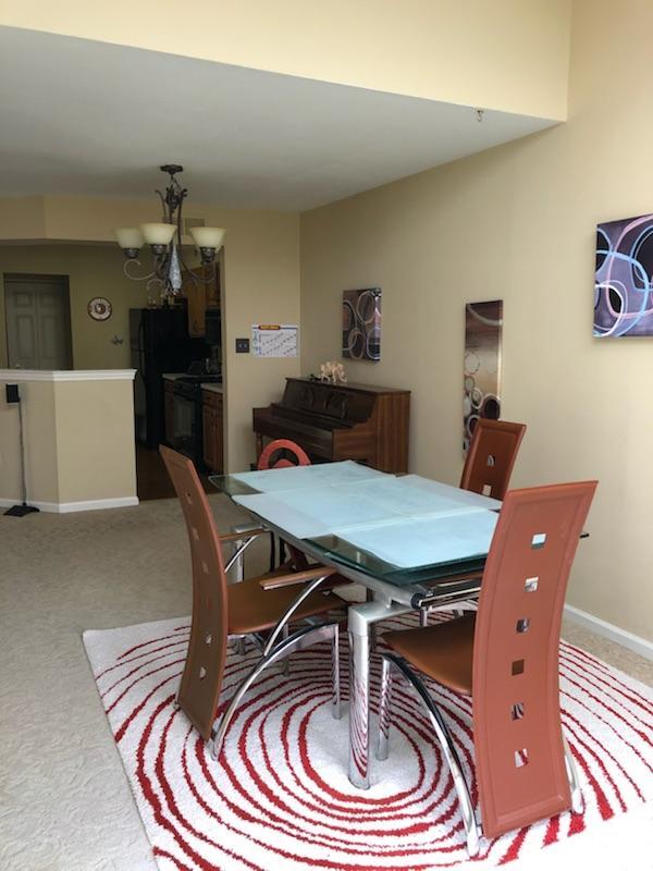 Eating area into kitchen - 218 E Village Ln
