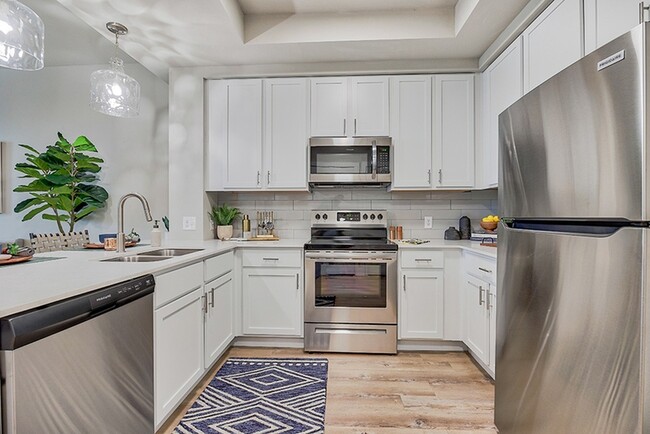 Open concept kitchens with efficient appliances - Charlotte Commons