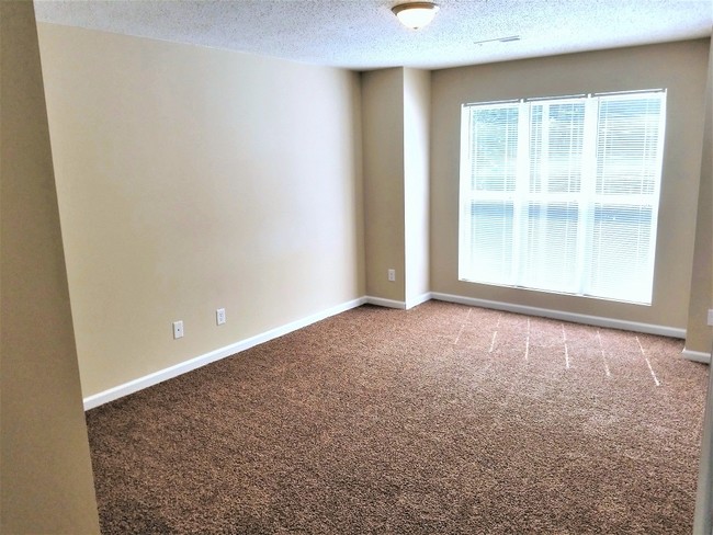 large master bedroom with walk-in closet - Dellwood Apartments