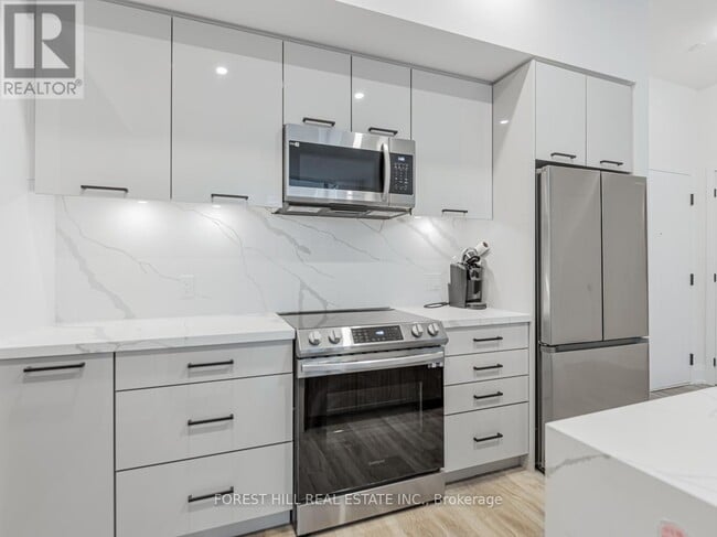 Photo du bâtiment - 415-415 Sea Ray Ave