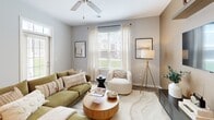 Located at 2331 Cadotte Dr SW in Wyoming, Michigan, this thoughtfully designed 2-bedroom, 3-bathroom residence offers a functional and stylish single-floor layout. The open-concept living and kitchen area serves as the heart of the home, where light wood-tone flooring, recessed lighting, and large windows allow natural light to flow throughout. The kitchen is outfitted with white shaker cabinetry, granite countertops, stainless steel appliances, and a peninsula with bar seating — ideal for casual dining or entertaining. The adjacent living room is bright and welcoming, featuring a ceiling fan, large windows with outdoor views, and a private exterior door entry. Both bedrooms offer plush carpeting, accent walls, and dedicated closets, with the primary bedroom providing a comfortable and well-proportioned retreat. The three full bathrooms each include granite-topped white vanities, tub-shower combinations, and wood-look flooring. Four closets throughout the unit ensure generous storage. A dedicated laundry room with full-size washer and dryer hookups adds everyday convenience. The overall aesthetic is clean and modern, with a neutral color palette that creates a calm, inviting ambiance throughout the home.
