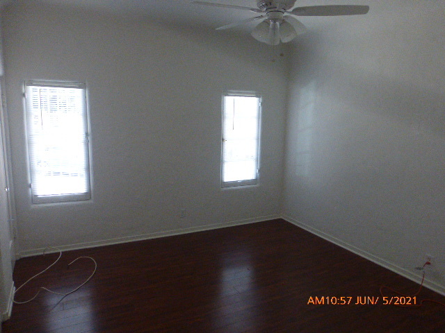 Bedroom with ceiling fan and 2 closets - 717 S Cochran Ave