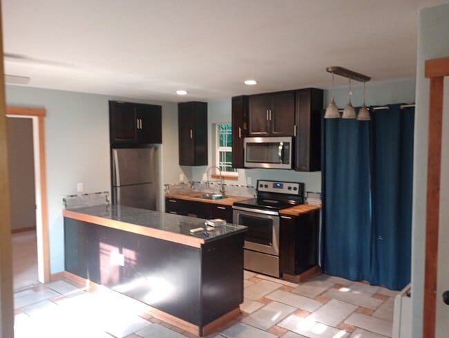 Kitchen and dining area - 3921 E 15th Ave