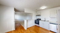 Located at 3419 Westmont St in Mount Vernon, Illinois, this single-story, 2-bedroom, 1-bathroom home offers a straightforward and functional layout. The kitchen is well-equipped with stainless steel appliances, including a gas range and refrigerator, complemented by white cabinetry, a double sink, and light hardwood-style flooring. A half-wall peninsula separates the kitchen from the adjacent living area, creating an open, connected feel between the two spaces. The living room features carpeted flooring, a textured ceiling, and a window that allows natural light to filter in. Both bedrooms are carpeted and finished with clean white walls and neutral tones. The primary bedroom is generously sized and includes a closet, while the second bedroom is a comfortable and bright space. The full bathroom is outfitted with a tub-shower combination, a vanity with storage, and hardwood-style flooring. Throughout the home, textured ceilings, white trim, and a bright, neutral color palette contribute to a clean and well-maintained interior. The property provides a practical and livable space suitable for a variety of occupants.