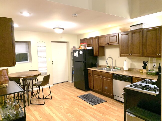 Kitchen with stainless steel appliances. - 1137 W 41st St