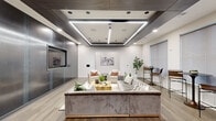 This thoughtfully designed single-floor lounge space offers a sophisticated blend of modern and industrial aesthetics across a well-appointed open floor plan. The interior immediately draws attention to its striking coffered ceiling, which features integrated LED linear lighting and recessed fixtures that create a warm, layered ambiance throughout the space. Wide-plank hardwood flooring in a neutral tone runs continuously underfoot, grounding the room with a cohesive and polished finish.

The main lounge area is anchored by a large, tufted velvet sectional sofa paired with accent chairs and a live-edge wood coffee table, offering ample space for relaxed gatherings. A row of high-top bistro tables and bar-height chairs lines a wall of oversized windows dressed with sheer roller shades, inviting natural light while maintaining privacy and offering views to the surrounding neighborhood.

A standout feature is the exposed brick accent wall at the rear, which frames a long bar-height island with a teal panel base and upholstered seating — ideal for socializing or informal dining. Dark wood beam detailing overhead complements the brick for a refined industrial touch. An imposing brushed metal column with an integrated media screen adds a bold, contemporary focal point. The overall ambiance is polished, welcoming, and versatile.