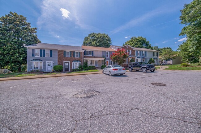 Building Photo - Freshly Updated 2 Bedroom Townhome with Fenced Outdoor Space – Convenient Greensboro Location