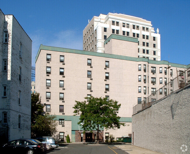 View from the southeast toward the main entrance - Plaza Apartments