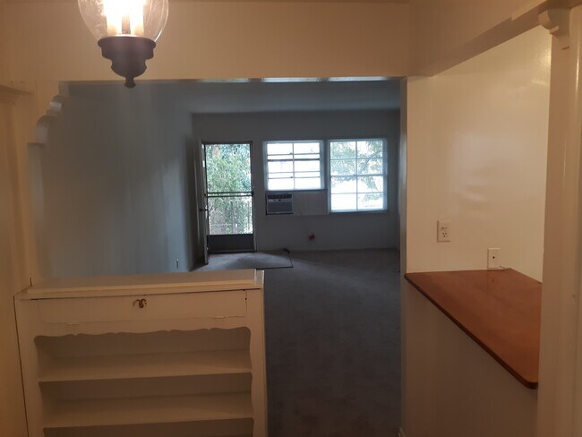 view from rear door through dining area to front door - 13309 Valleyheart Dr N