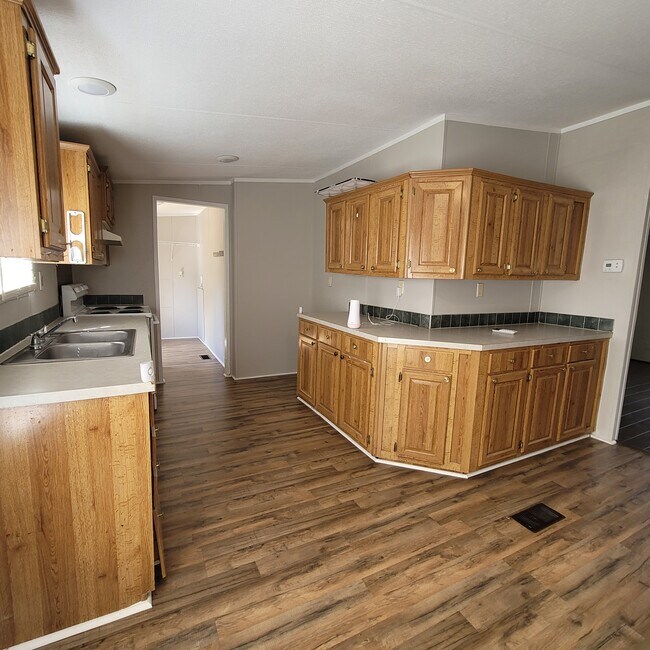 kitchen to laundry room - 31219 Wide Oak Cir