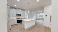 This thoughtfully designed 2-bedroom, 2-bathroom residence at 300 Main St in Madison, NJ offers a clean, modern aesthetic across a well-proportioned single-floor layout. The open-concept kitchen, dining, and living area serves as the heart of the home, anchored by a striking white center island with pendant lighting overhead. The kitchen is outfitted with soft gray shaker-style cabinetry, white quartz countertops, a herringbone tile backsplash, and stainless steel appliances including a gas range and French door refrigerator. Light wood-tone flooring flows seamlessly throughout the main living areas and bedrooms, enhancing the bright, airy ambiance created by recessed lighting and natural light from well-placed windows. The spacious primary bedroom offers a generous footprint with a dedicated closet, while the second bedroom provides a comfortable and versatile space. Both bathrooms are finished with large-format tile flooring, gray vanity cabinetry, white quartz countertops, and glass-enclosed shower or tub enclosures. Additional conveniences include in-unit laundry and an abundance of closet storage throughout. The overall design is cohesive, contemporary, and move-in ready.