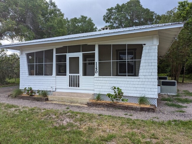 Building Photo - Relax on the front screened porch!