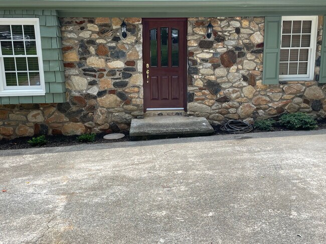 Solid stone work and front door - 35 Simpson Dr NE