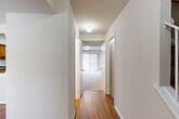 Located at 452 College Pkwy in Rockville, MD, this three-story home offers a thoughtfully organized layout across its four bedrooms and three bathrooms. The main level features a living room, a dedicated dining room, and a kitchen equipped with warm oak cabinetry, dark granite-style countertops, a tile backsplash, and black appliances including a gas range and dishwasher. Hardwood-style flooring flows through the main living areas, complementing the neutral, light-toned walls throughout. A staircase connects each level, providing clear circulation between floors. The upper level hosts the bedrooms, including a generously sized primary bedroom with a large closet. Bedrooms feature plush carpeting and windows that bring in natural light. The bathrooms are clean and functional, with white tile surrounds and full soaking tubs. A family room adds additional gathering space to the home. The basement level provides substantial utility space with exposed structural elements, housing mechanical systems and offering ample storage potential. A closet rounds out the storage options. The home's neutral palette and consistent finishes across all three floors create a cohesive and practical living environment suitable for a variety of needs.