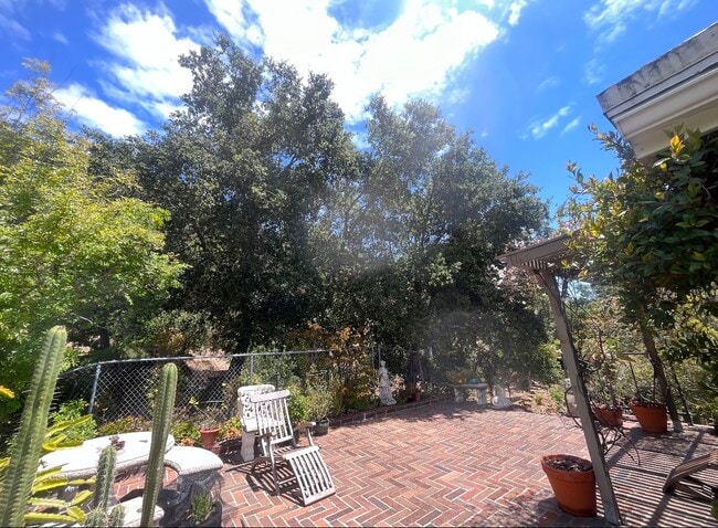 Private patio surrounded by trees - 2188 Latimer Ln