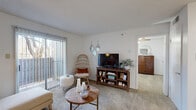 Located at 200 N Mesa Hills Dr in El Paso, TX, this well-appointed one-bedroom, one-bathroom unit offers a functional and inviting layout across a single floor. The open-concept living and kitchen area serves as the heart of the home, with plush carpeting underfoot in the living space and tile flooring in the kitchen. Sliding glass doors with vertical blinds open to a private balcony, allowing natural light to fill the room. The kitchen features warm wood cabinetry, light countertops, a double-basin sink, white appliances including a dishwasher and refrigerator, and a skylight that brightens the space. The bedroom is a comfortable retreat, benefiting from natural light through a large window dressed with sheer curtains, and includes a ceiling fan for year-round comfort. A dedicated closet provides practical storage. The full bathroom is neatly appointed with a tub-shower combination. Throughout the unit, the white walls and neutral tones create a clean, bright ambiance that lends itself well to personalization. The overall layout makes efficient use of its footprint, offering a complete and livable space in a convenient El Paso location.