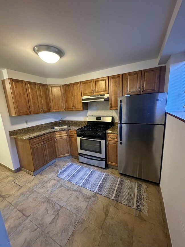 Kitchen with sink stove and fridge - 2234 Kingsland Ave