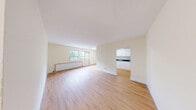 Located on the fourth floor at 30-34 St Dennis Drive in Toronto's Don Mills neighbourhood, this two-bedroom, one-bathroom unit offers a practical and well-organized layout. Light hardwood flooring runs consistently throughout, lending a clean, cohesive look to the entire space.

The galley-style kitchen is efficiently designed, featuring white cabinetry, dark granite-style countertops, a stainless steel sink, and ample upper and lower storage — ideal for everyday cooking needs.

Both bedrooms are comfortably sized, each equipped with built-in closets featuring double doors for generous storage. Natural light enters through large windows fitted with radiator heating units beneath, offering views of the surrounding greenery and urban streetscape. The primary bedroom benefits from an especially bright outlook with a wide window overlooking the neighbourhood.

The bathroom is clean and functional, finished with white tilework and a full-size soaker tub with an overhead shower.

A welcoming hallway connects all areas of the unit, and a private balcony extends the living space outdoors, providing open views of St Dennis Drive and the lush tree canopy and adjacent residential buildings — a pleasant outlook within this established Toronto community.