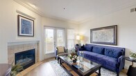 Located in San Marcos, CA, this thoughtfully designed 2-bedroom, 2-bathroom residence offers a comfortable and functional single-floor layout. The living room serves as the heart of the home, featuring a tile-surround fireplace, crown molding, and French doors that invite natural light and outdoor views. Light wood-tone flooring flows consistently throughout the space, creating a cohesive and airy feel.

The kitchen is well-equipped with warm wood cabinetry, granite countertops, a double stainless steel sink, and black appliances including a gas range and refrigerator. A pass-through peninsula connects the kitchen to the adjacent dining area, which features a pendant light fixture and crown molding detail.

The spacious primary bedroom offers multiple windows with outdoor views and a serene, light-filled atmosphere. The second bedroom is equally well-sized, with a window providing natural light and space for a dedicated work area. Both bathrooms are finished with granite-topped vanities, warm wood cabinetry, and tub-shower combinations with curved curtain rods.

A dedicated laundry area houses a stacked washer and dryer unit, adding everyday convenience. The home also includes a hallway, closet, and an efficient layout that maximizes every square foot of living space.