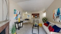 Located at 16550 Henderson Pass in San Antonio, TX, this one-bedroom, one-bathroom unit offers a thoughtfully designed single-floor layout that maximizes functionality and comfort. The open-concept living and dining area is carpeted and bathed in natural light, flowing seamlessly toward a private balcony accessible through a sliding glass door. A classic brick fireplace serves as a focal point in the living room, adding warmth and character to the space. The kitchen features rich dark cabinetry, granite-style countertops, wood-look vinyl flooring, and black appliances including a range, microwave, and refrigerator. A pass-through counter with bar seating connects the kitchen to the main living area, making it ideal for casual dining and entertaining. The generously sized bedroom includes plush carpeting, a window with natural light, and access to multiple closets for ample storage. The full bathroom continues the cohesive design with dark wood cabinetry and granite-style countertops. A dedicated in-unit laundry room with full-size washer and dryer hookups and built-in shelving adds everyday convenience. A hallway connects the main living spaces to the bedroom and bathroom, completing this efficient and comfortable layout.