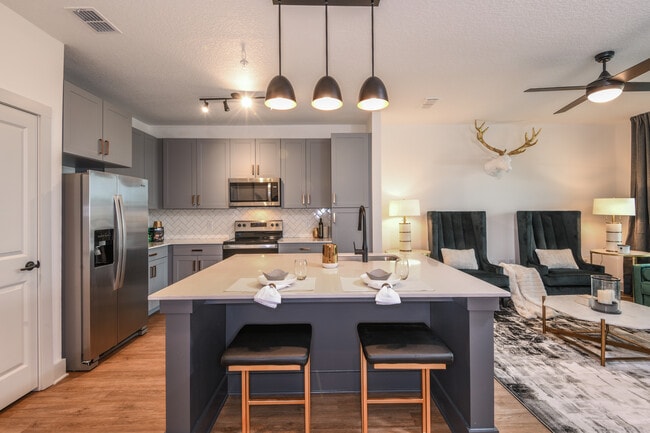 Cook, dine, and gather in a stylish kitchen space. - The Menlo