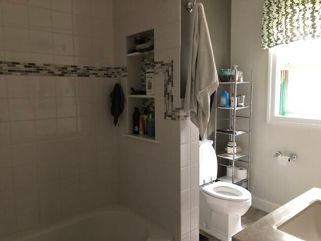 Updated tile bathroom with Walk icedar closet - 306 West Ave