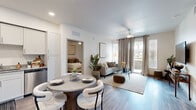 Located at 9600 W Georgia Ave in Glendale, AZ, this single-floor residence offers four bedrooms and two bathrooms within a thoughtfully designed layout. The open-concept living and dining area is finished with wood-style plank flooring and bathed in natural light from large sliding glass doors that lead to a private balcony with views of the surrounding community, including lush landscaping and palm trees. A ceiling fan adds comfort to the airy living space. The kitchen features white shaker cabinetry, granite-style countertops, stainless steel appliances, and recessed lighting, with a round dining table positioned nearby for casual meals. The primary bedroom is a comfortable retreat with a ceiling fan, large window with drape treatments, and access to closet space. Additional bedrooms maintain the same clean, neutral aesthetic with ceiling fans and ample natural light. The bathrooms are appointed with white vanities, granite countertops, and wood-style flooring. Two closets provide practical storage throughout. The exterior features covered parking with a pergola-style canopy, desert landscaping, and well-maintained green spaces, reflecting the modern community setting of this Glendale property.