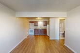 Located at 2473 Ladley Ct in Springfield, Illinois, this one-bedroom, one-bathroom unit offers a practical and well-organized layout across a single floor. The open-concept kitchen and living area forms the heart of the space, featuring warm hardwood-style flooring, rich dark wood cabinetry, granite-look countertops, and white appliances including a range and refrigerator. A pantry provides additional storage, while a textured ceiling adds architectural character throughout the common areas. The living area is bright and open, with a window that allows natural light to filter in, and includes a wall-mounted thermostat for climate control. The bedroom is a comfortable size, finished with soft carpeting and its own window overlooking the outdoors. Two closets serve the unit, providing ample storage options. The full bathroom is clean and functional, featuring tile flooring, a tub/shower combo, toilet, and a vanity with a white sink. Neutral wall tones and consistent finishes throughout the unit create a cohesive and move-in-ready atmosphere, making this an efficient and well-appointed space suited for everyday living.