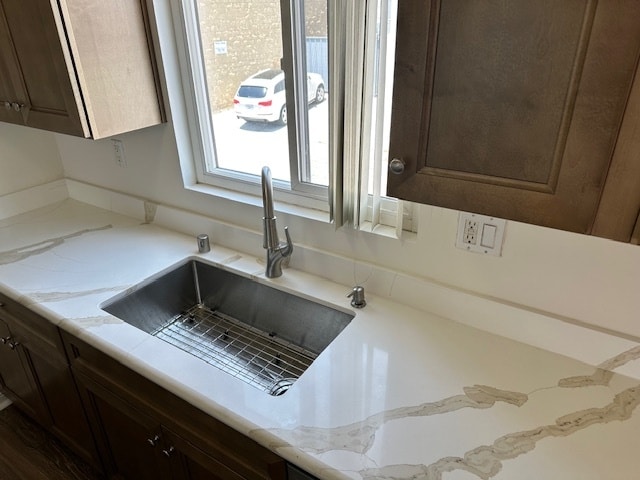 Bright countertops, modern cabinetry, and deep sink - 5510 Adelaide Ave