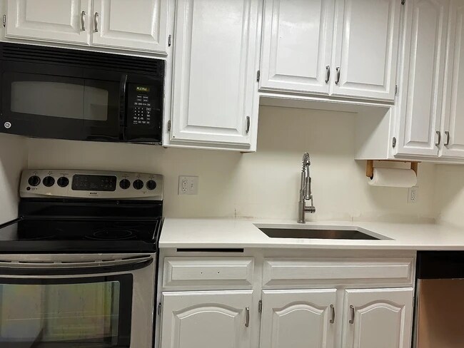 New quartz countertops, sink, garbage disposal and dishwasher installed in July 2025 - 35 Nathan Ln N