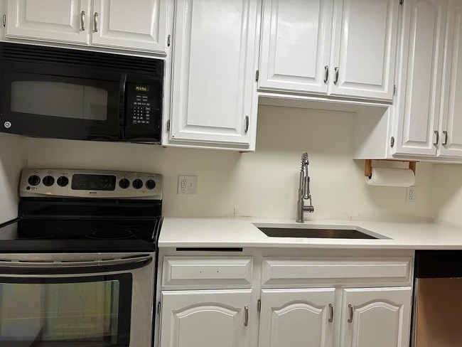New quartz countertops, sink, garbage disposal and dishwasher installed in July 2025 - 35 Nathan Ln N